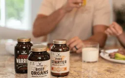 Heart & Soil supplement jars on a breakfast table